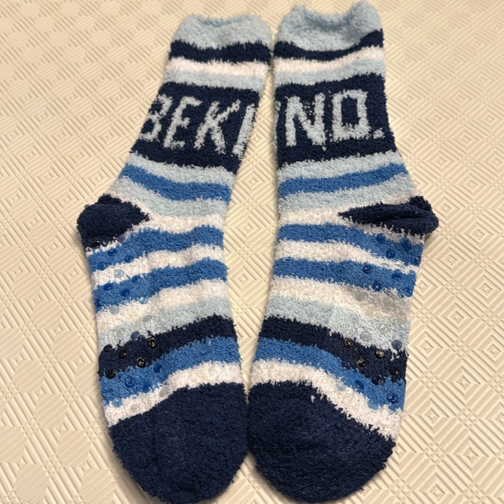 Fuzzy socks with be kind wording. Brand new.